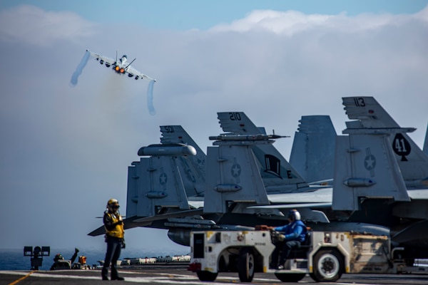 An F/A-18F Super Hornet, attached to Strike Fighter Squadron (VFA) 41, launches from the flight deck of the Nimitz-class aircraft carrier USS Abraham Lincoln (CVN 72) during Northern Edge 2025 (NE25).