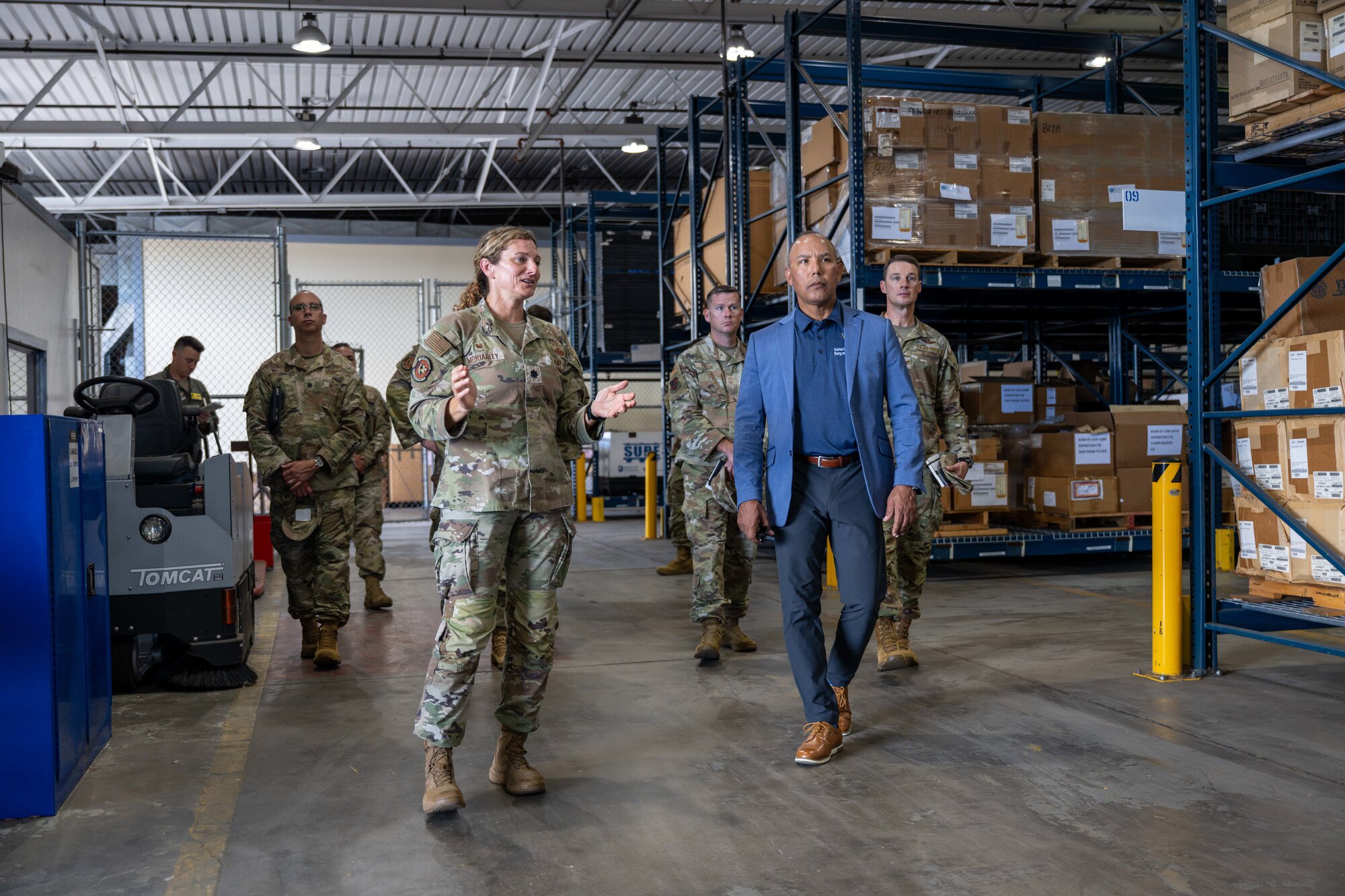 U.S. Air Force personnel tour a warehouse on Joint Base Pearl Harbor-Hickam, Hawaii.