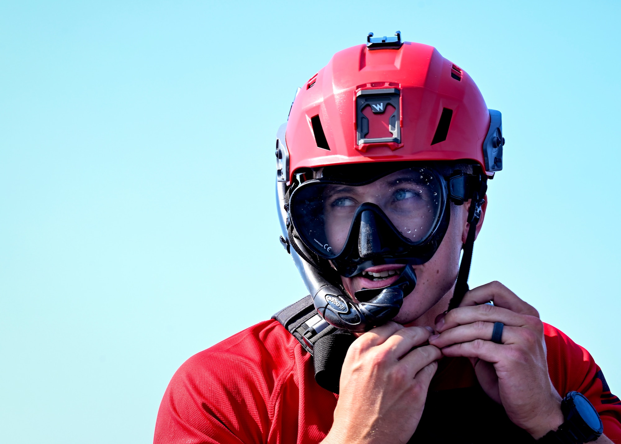 survival, evasion, resistance and escape specialist, buckles his helmet