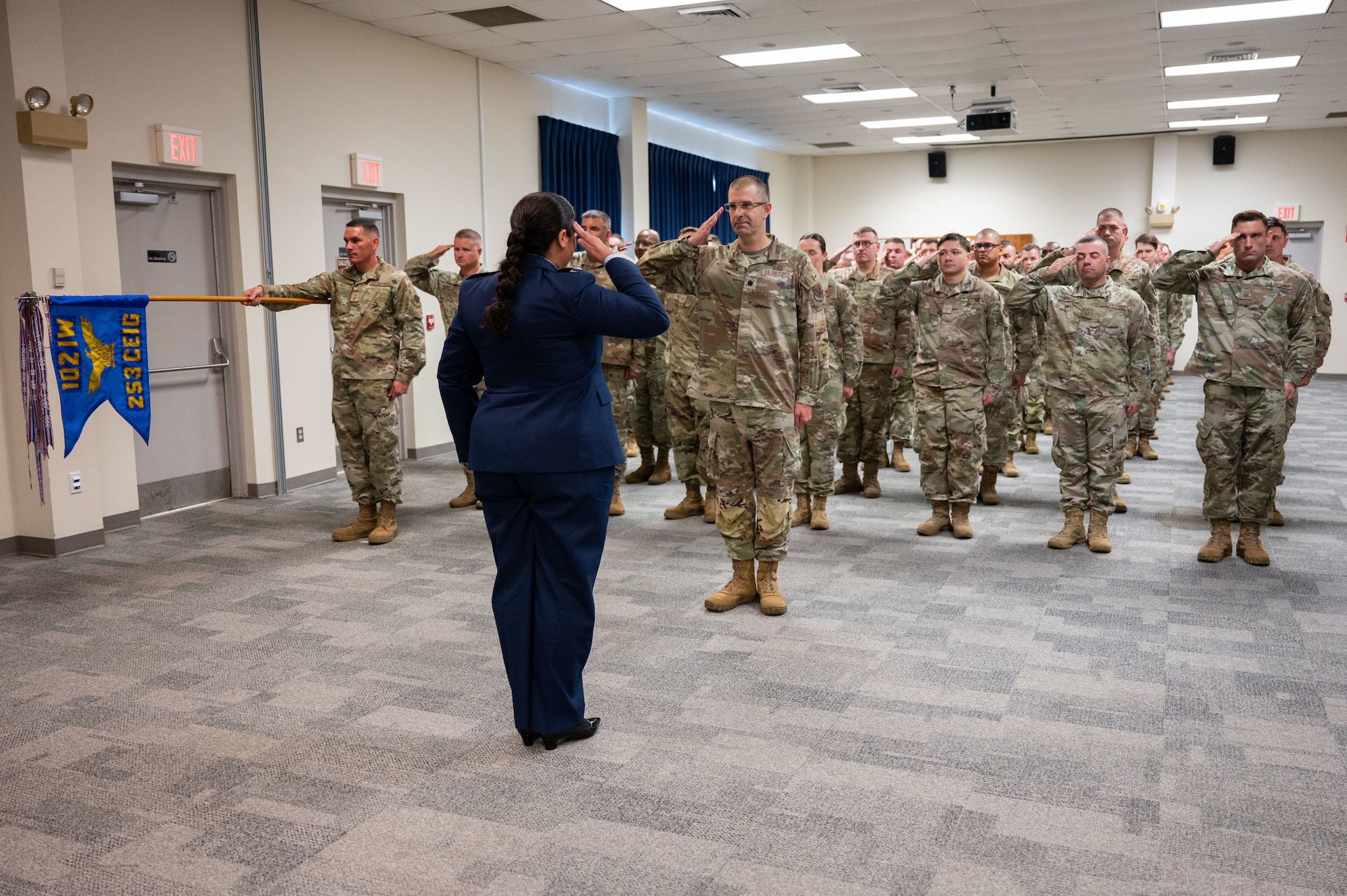Commander salutes Airmen in formation.