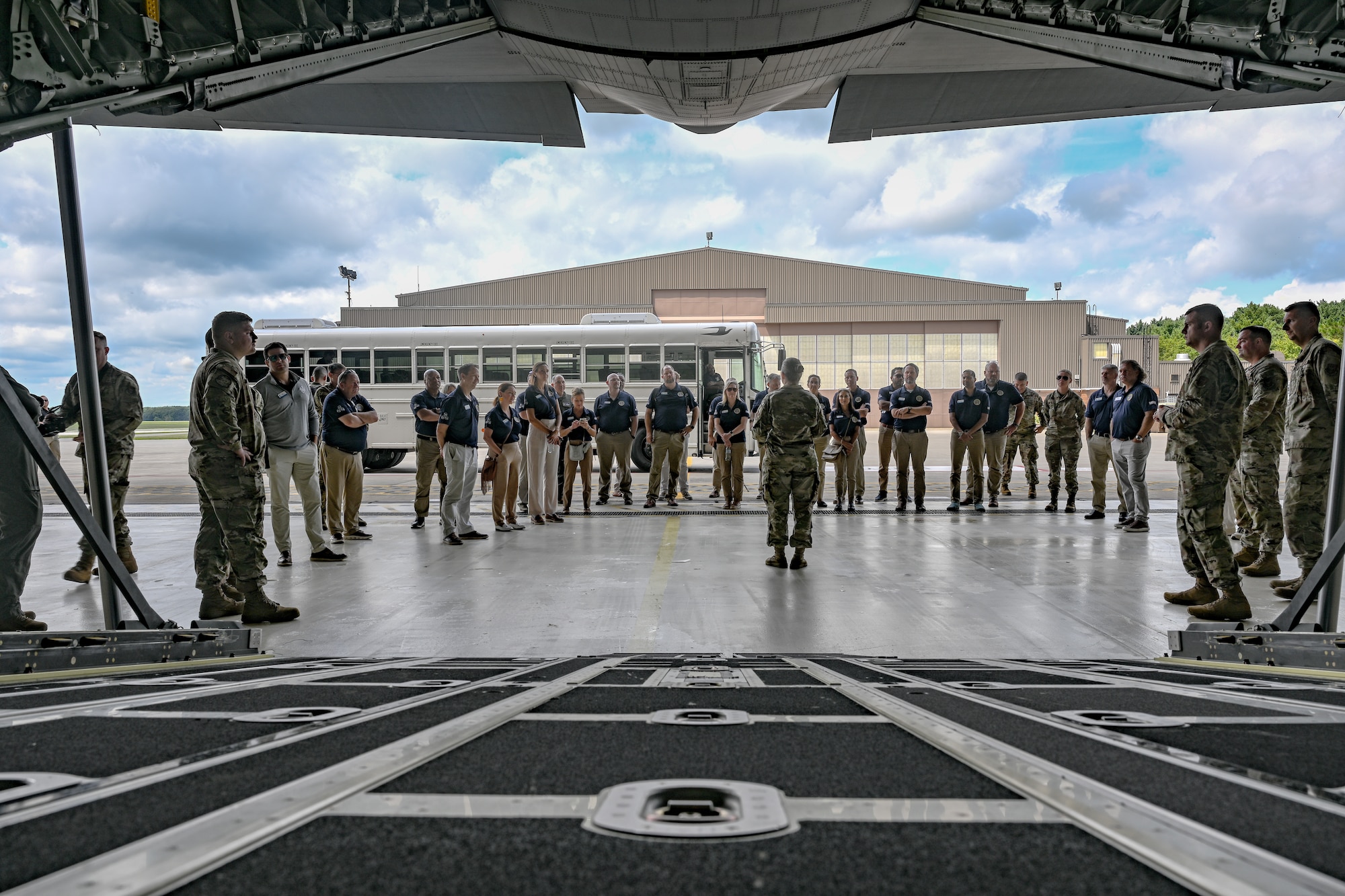 Civic leaders from Dobbins Air Reserve Base, Georgia, listen to a C-130J-30 Super Hercules maintenance briefing on Aug. 13, 2025, at Youngstown Air Reserve Station, Ohio.