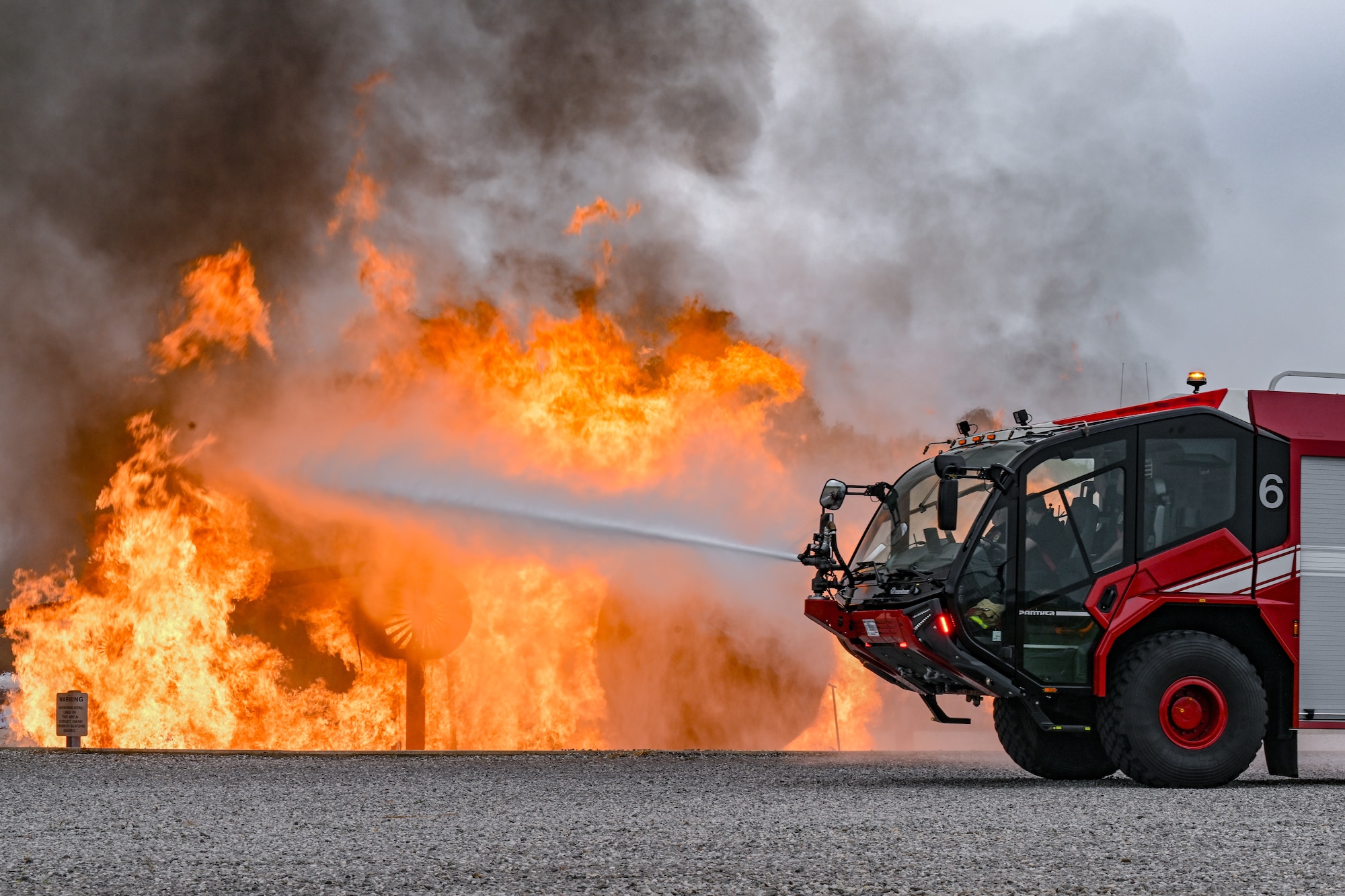 910th Airlift Wing firefighters perform a fire demonstration for civic leaders from Dobbins Air Reserve Base, Georgia, on Aug. 14, 2025, at Youngstown Air Reserve Station, Ohio.