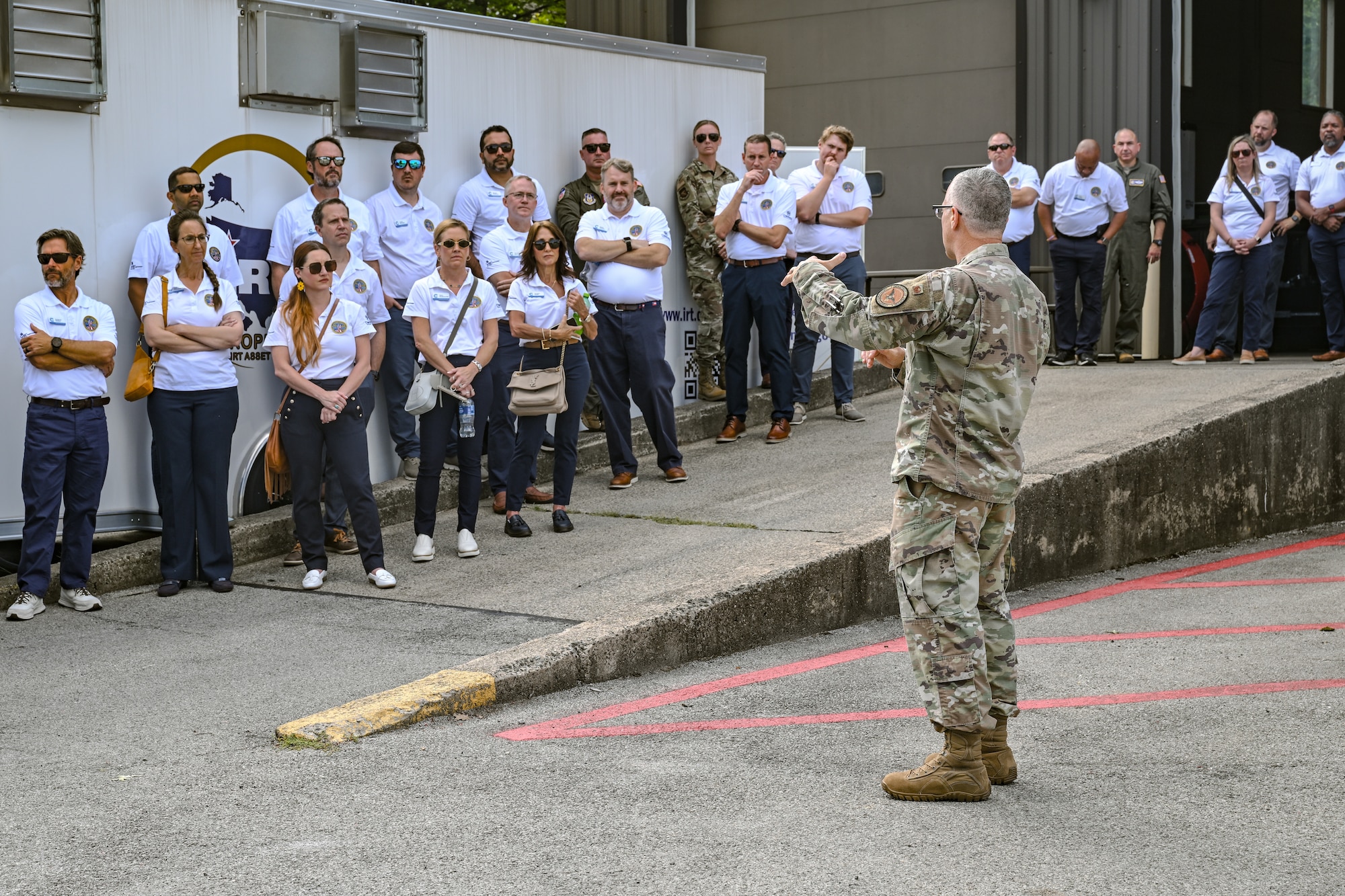 Civic leaders from Dobbins Air Reserve Base, Georgia, listen to an Innovative Readiness Training briefing during a tour of their consolidated asset management site on Aug. 14, 2025, at Youngstown Air Reserve Station, Ohio.