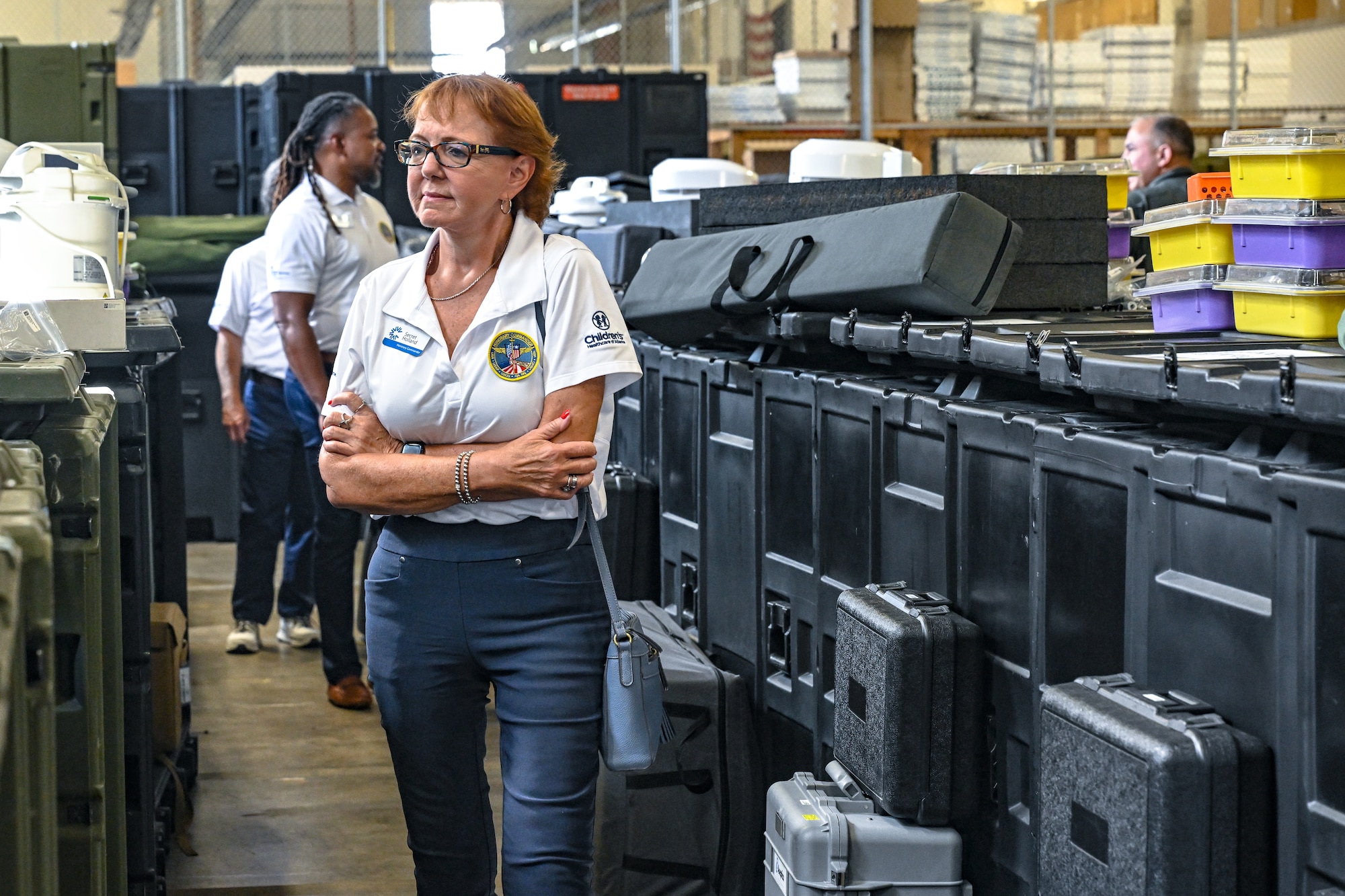 A civic leader from Dobbins Air Reserve Base, Georgia, views the Innovative Readiness Training equipment during a tour of the consolidated asset management site on Aug. 14, 2025, at Youngstown Air Reserve Station, Ohio.