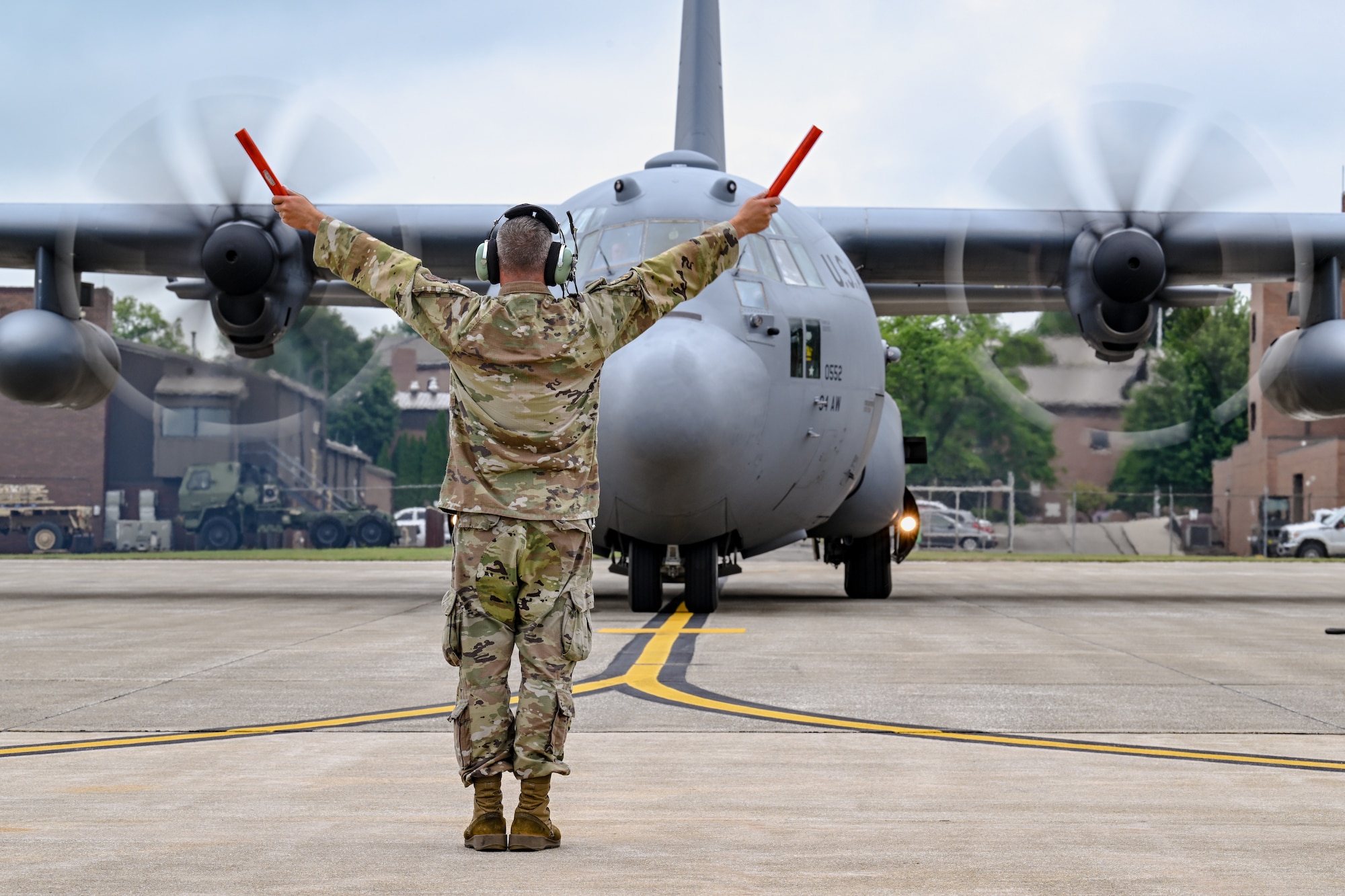 Master Sgt. Levi Boyd, a maintenance craftsman with the 910th Aircraft Maintenance Squadron, marshals in a C-130H Hercules assigned to the 94th Airlift Wing on Aug. 13, 2025, at Youngstown Air Reserve Station, Ohio.