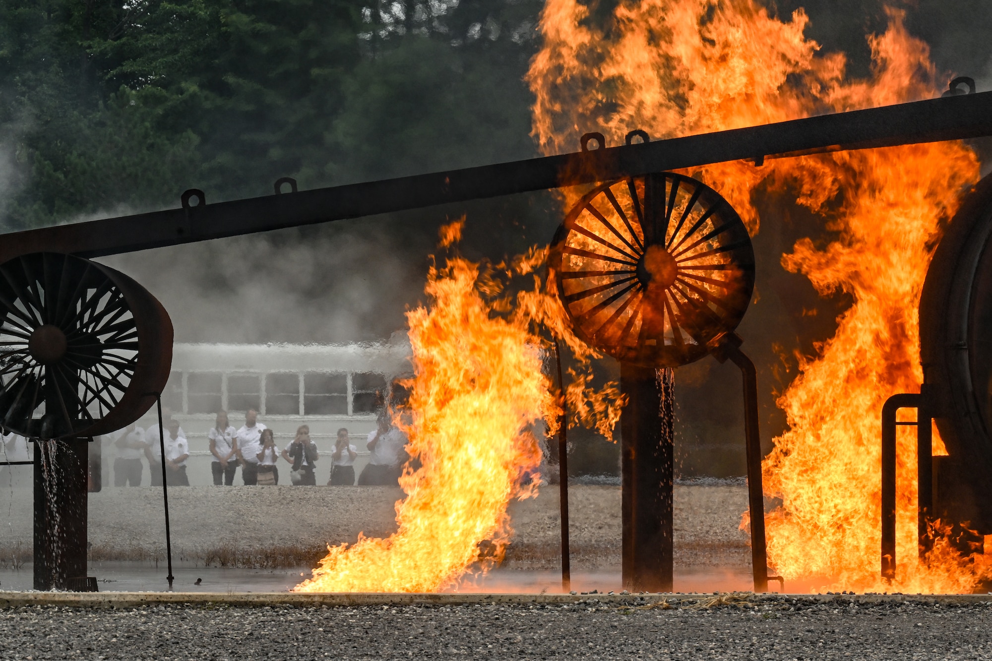Civic leaders from Dobbins Air Reserve Base, Georgia, watch a fire demonstration on Aug. 14, 2025, at Youngstown Air Reserve Station, Ohio.