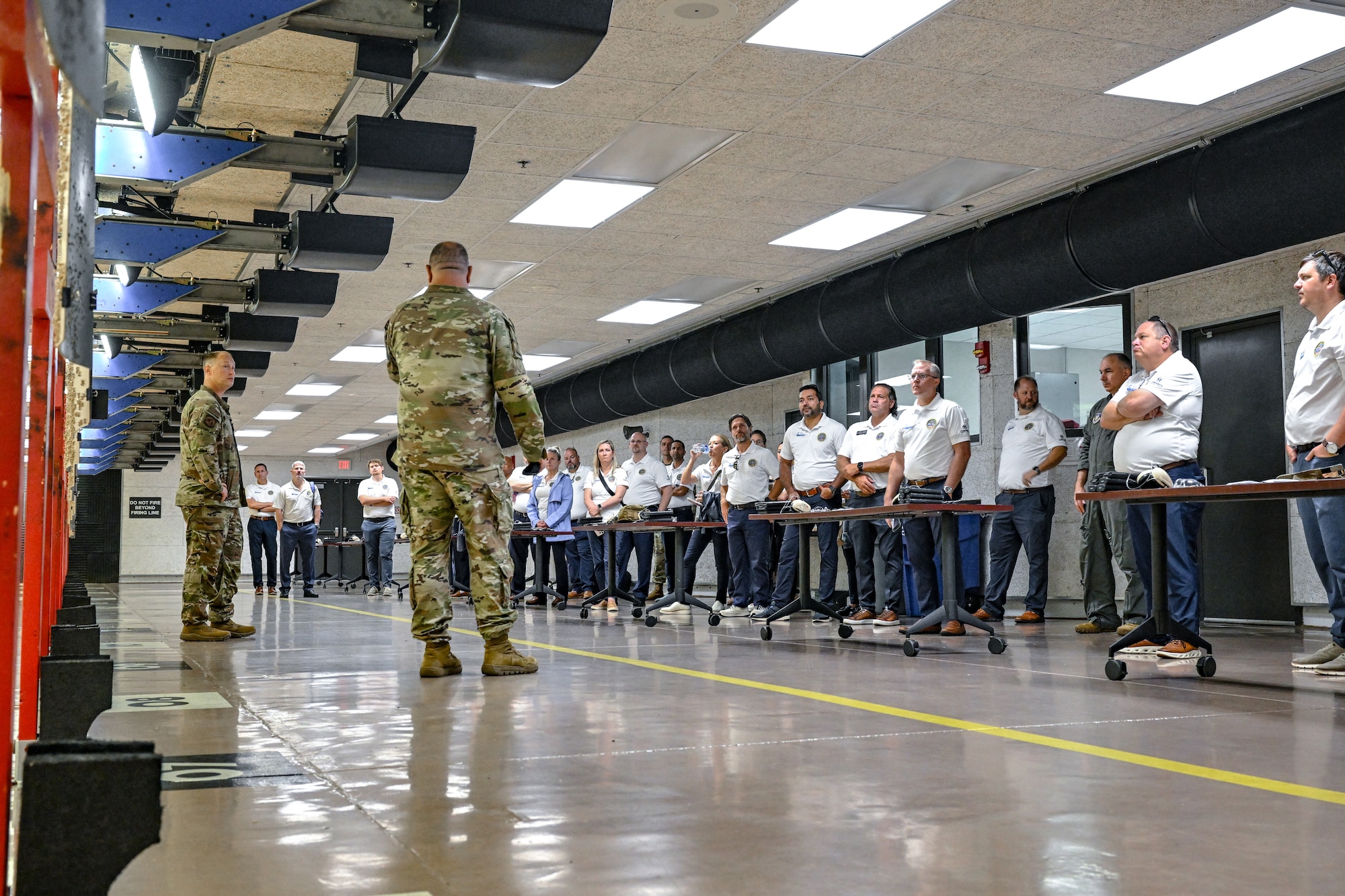 Civic leaders from Dobbins Air Reserve Base, Georgia, listen to a security forces briefing during a firing range tour on Aug. 14, 2025, at Youngstown Air Reserve Station, Ohio.