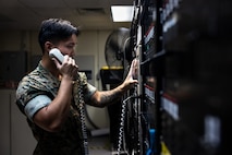 U.S. Marine Corps Cpl. Kevin Madriaga, an air traffic control communications technician, with Air Traffic Control Platoon completes a process called “turn ups” to ensure communications between aircraft and the tower are intact, at Marine Corps Air Station New River in Jacksonville, North Carolina, Aug. 25, 2025. Madriaga, the recipient of the August MCAS New River Go-Getter award, enlisted in March of 2022 from Sacramento, California. (U.S. Marine Corps photo by Sgt. Yvonna Guyette)