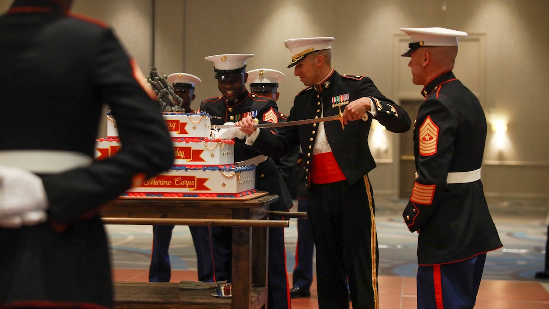U.S. Marine Corps Maj. Thomas Fischer, Commanding Officer of Recruiting Station Atlanta (RS Atlanta), cuts a slice of the 249th Marine Corps Birthday cake during the cake cutting ceremony of the RS Atlanta 249th Marine Corps Birthday Ball at the Chateau Elan, Braselton, Georgia, Oct. 25, 2024. Symbolically, the eldest Marine present passes a piece of cake to the youngest Marine, signifying the passing of experience and knowledge from the old to the young of the Marine Corps. (U.S. Marine Corps photo by Sgt. Alexander Ransom)