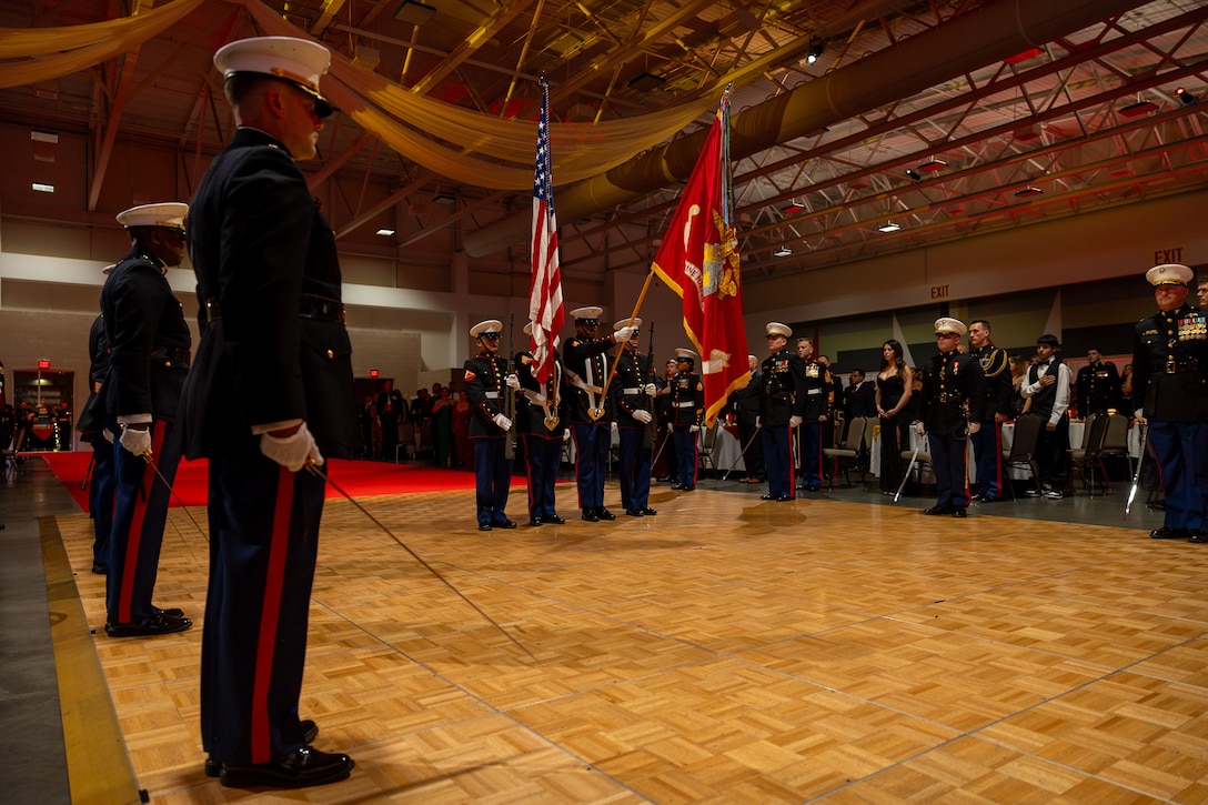 U.S. Marines with Marine Forces Special Operations Command honor the colors during MARSOC’s 249th Marine Corps Birthday Ball at the Wilmington Convention Center, Wilmington, North Carolina, Nov. 14, 2024. The Marine Corps Birthday Ball honors the history and traditions passed down since the founding of the Corps and remembers those who have sacrificed for Corps and Country. (U.S. Marine Corps photo by Lance Cpl. Salvador Flores Perez)