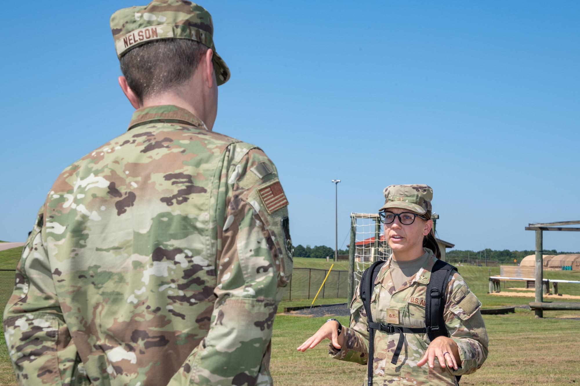 U.S. Air Force Brig. Gen. Jeffrey W. Nelson, commander of the Air Force Accessions Center and Air Force Recruiting Service at Joint Base San Antonio-Randolph, Texas, speaks with officer trainee Amanda Fore