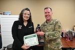 Registered Nurse Susan Clapp poses for a photo with her team after receiving the CRDAMC Outpatient DAISY award.