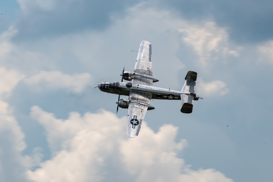 A B-25 Mitchell bomber flies over the 122nd Fighter Wing in Fort Wayne, Indiana, July 11, 2025.