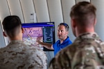Mark Ketcham, Aerostar, provides warfighter feedback to Marines who attended a technical demonstration held at Outlying Landing Field Seagle in Twentynine Palms, Calif. May 19-21, 2025. The U.S. Naval Research Laboratory in conjunction with the Operational Energy Capability Improvement Fund with the Office of the Assistant Secretary of Defense for Energy, Installations, and Environment, and the Marine Corps Expeditionary Energy Office (E2O)  conducted the demonstration aiming to develop a technology for Navy vessels to "see over the horizon" using a combination of stratospheric high-altitude balloons (HABs) and unmanned aircraft.  (U.S. Marine Corps photo by Pfc. Jozef Mejewski/Released)