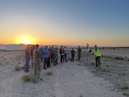 Attendees receive a briefing meeting during a technical demonstration held at Outlying Landing Field Seagle in Twentynine Palms, Calif. May 19-21, 2025. The U.S. Naval Research Laboratory in conjunction with the Operational Energy Capability Improvement Fund with the Office of the Assistant Secretary of Defense for Energy, Installations, and Environment, and the Marine Corps Expeditionary Energy Office (E2O) conducted the demonstration aiming to develop a technology for Navy vessels to "see over the horizon" using a combination of stratospheric high-altitude balloons (HABs) and unmanned aircraft.  (U.S. Navy Photo by Rick Stroman)