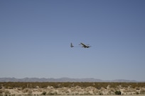 A Stalker unmanned air system (UAS) takes off during a technical demonstration held at Outlying Landing Field Seagle in Twentynine Palms, Calif. May 19-21, 2025. The U.S. Naval Research Laboratory in conjunction with the Operational Energy Capability Improvement Fund with the Office of the Assistant Secretary of Defense for Energy, Installations, and Environment, and the Marine Corps Expeditionary Energy Office (E2O) conducted the demonstration aiming to develop a technology for Navy vessels to "see over the horizon" using a combination of stratospheric high-altitude balloons (HABs) and unmanned aircraft.  (Photo by Christopher Fischelli)
