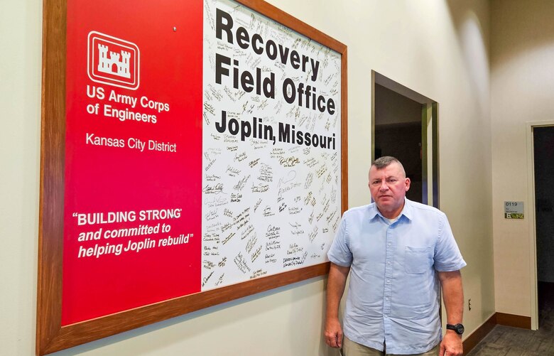 Man standing in the lobby of his office