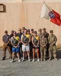 Members of the 17th Sustainment Brigade, Nevada Army National Guard, pose for a photo during their running of the Reno Tahoe Odyssey while deployed in the Middle East earlier this year.