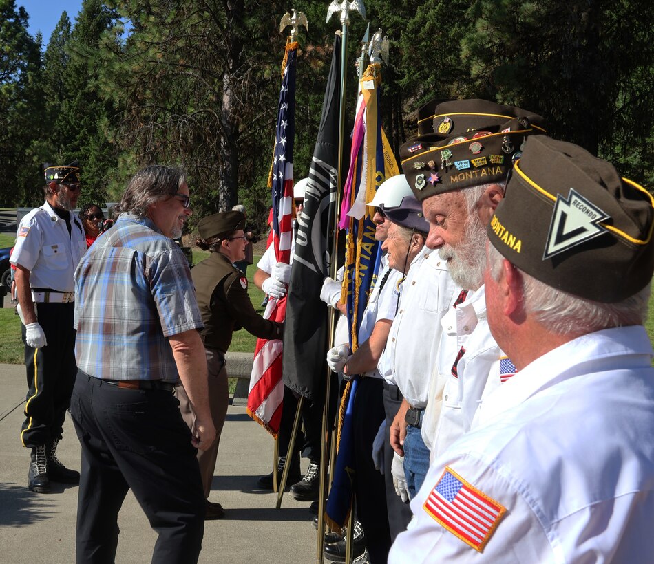 Libby Dam Operating Project Manager Rick Spiger and U.S. Army Corps of Engineers, Seattle District Commander Col. Kathryn Sanborn thank members of the VFW and American Legion, who presented the Colors and performed Taps, during Libby Dam's 50th commemoration, Aug. 23, 2025. The event also included a memorial unveiling, public access to the top of the dam and touring the Treaty Tower.