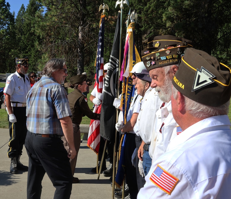 Libby Dam Operating Project Manager Rick Spiger and U.S. Army Corps of Engineers, Seattle District Commander Col. Kathryn Sanborn thank members of the VFW and American Legion, who presented the Colors and performed Taps, during Libby Dam's 50th commemoration, Aug. 23, 2025. The event also included a memorial unveiling, public access to the top of the dam and touring the Treaty Tower.