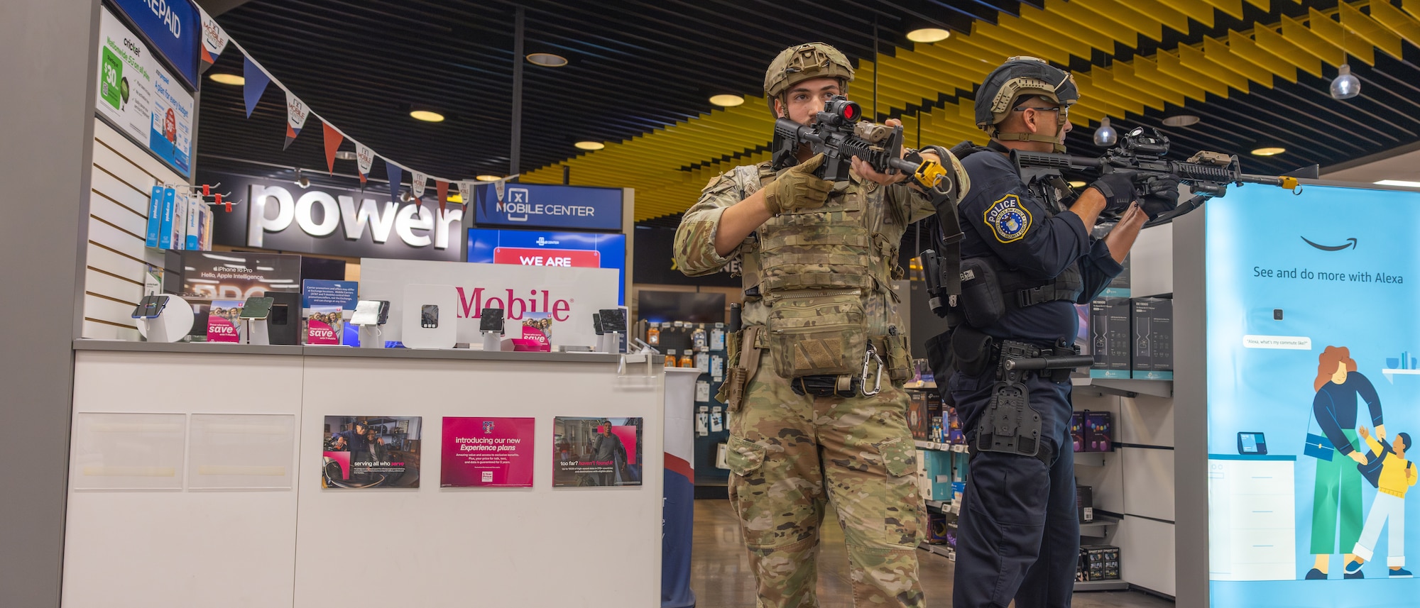 Airmen carrying rifles in grocery store