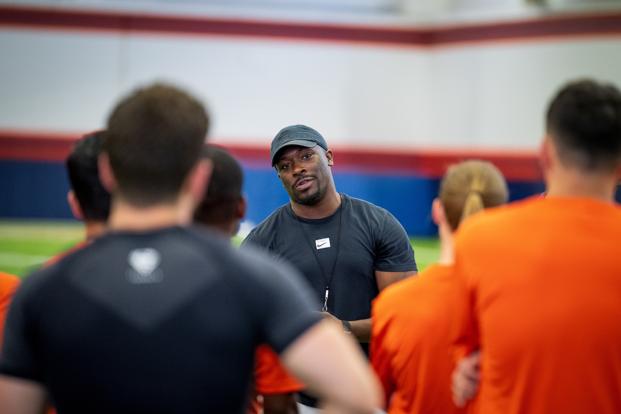 man talking to group of service members