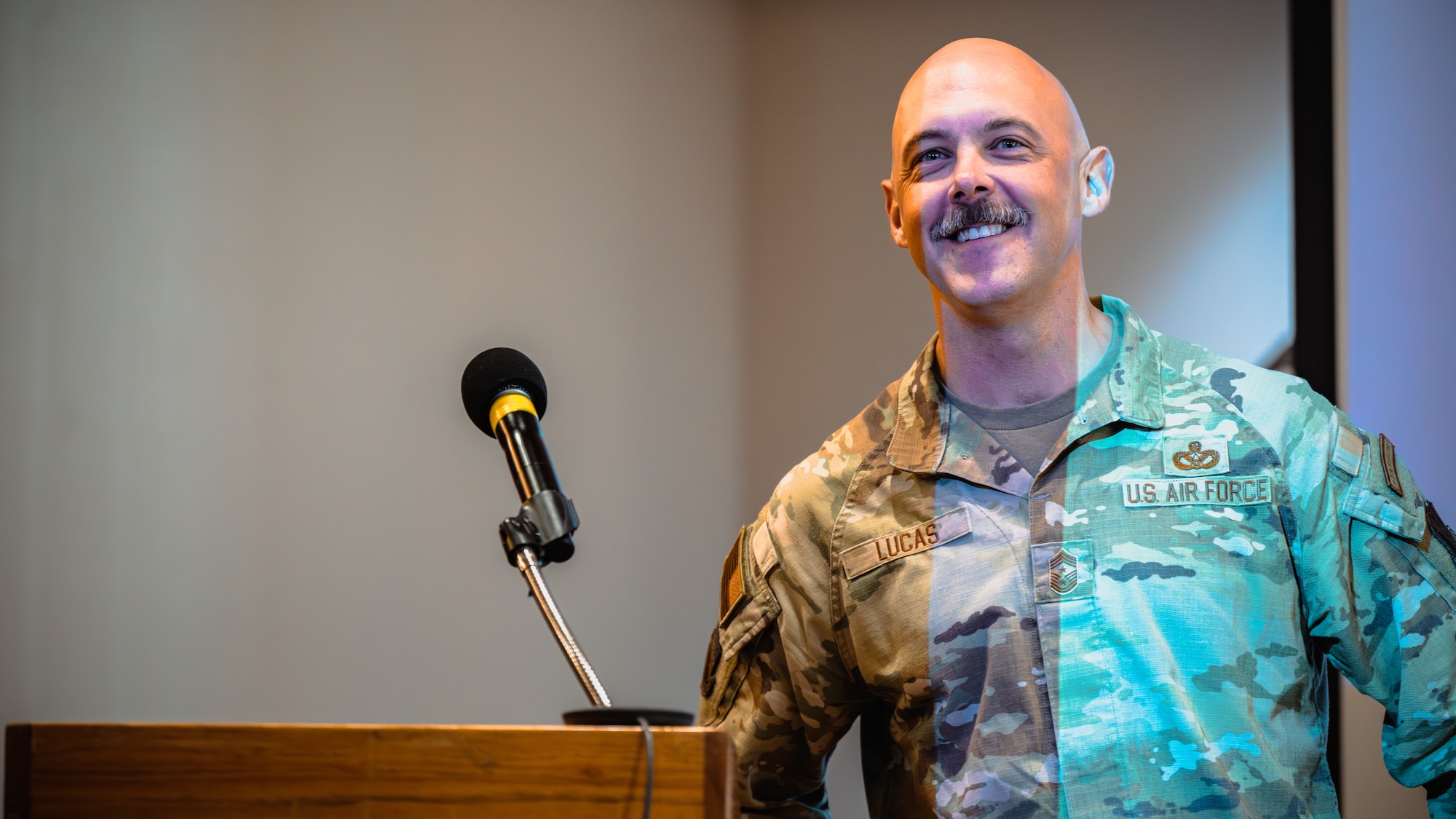 The 325th Fighter Wing command chief, smiles during an All Call