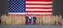 U.S. Air Force Airman 1st Class Tykhon Rudenok, 2nd Civil Engineer Squadron heating, ventilation and air conditioning journeyman, poses for a photo with his leadership and fellow Airmen during a Naturalization Ceremony at Barksdale Air Force Base, Louisiana, July 15, 2025. Rudenok is currently serving in the Air Force to give back to the country that gave him opportunities when he immigrated to the U.S. (U.S. Air Force photo by Airman 1st Class Jaiyah Lewis)