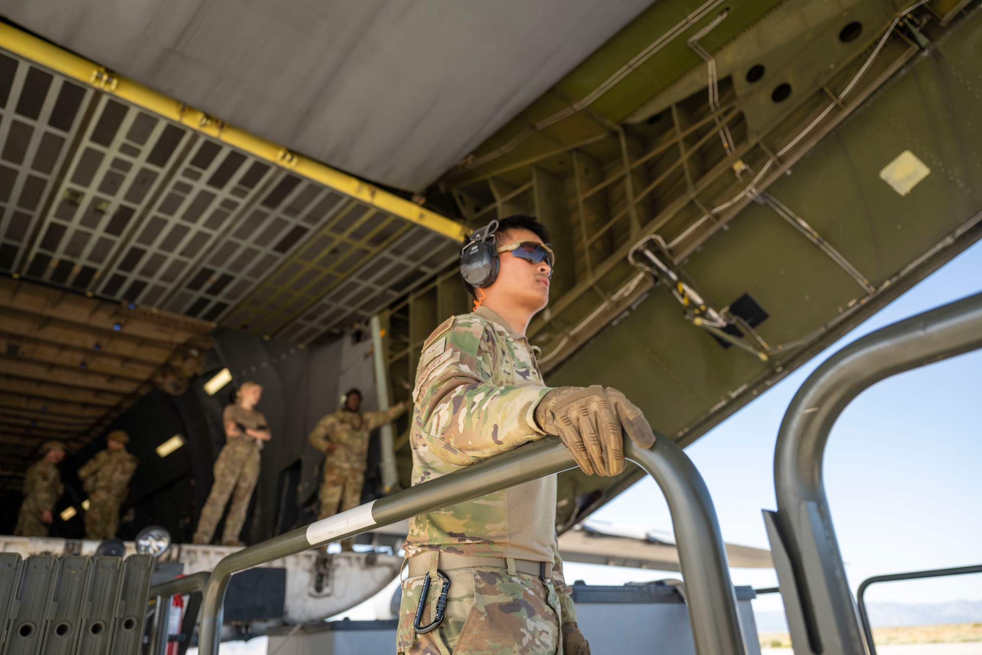 A group works to unload an aircraft