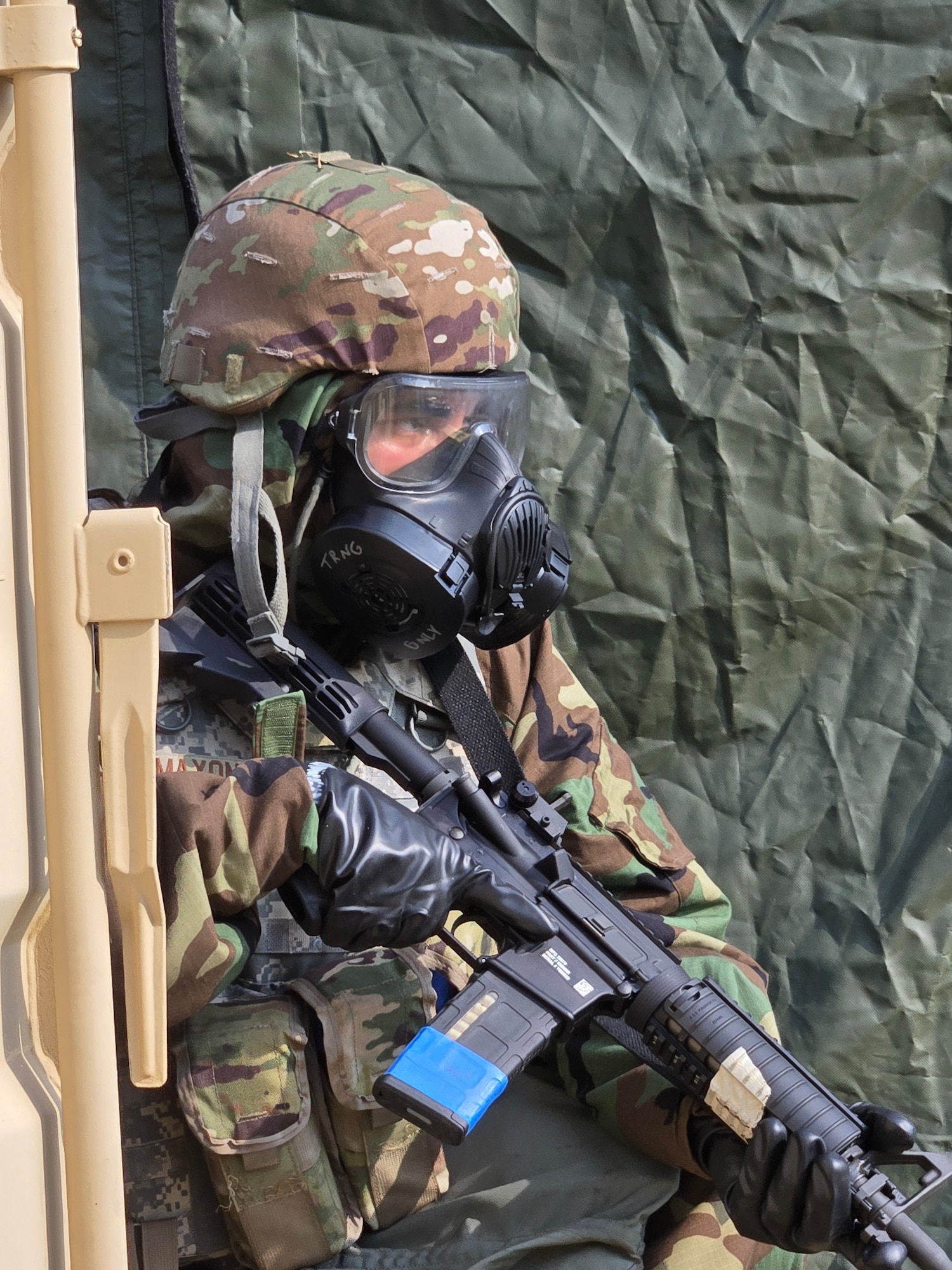 Staff Sgt. Eric Maxon, 131st Force Support Squadron services NCO, scans his sector of fire during a base defense drill during exercise Northern Strike 25-2 at Fort Custer, Michigan, Aug. 8, 2025. Northern Strike is a National Guard led exercise designed to strengthen warfighting capabilities and develop leaders while enhancing joint interoperability. (U.S. Air National Guard photo by Master Sgt. John E. Hillier)