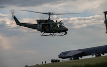A UH-1N Iroquois takes off from the flightline for a seven-ship formation flight during a Tactical Response Force exercise at Minot Air Force Base, North Dakota, Aug. 21, 2025. The seven helicopters carried Tactical Response Force members for an exercise, employing airpower and air superiority in defense of our nation’s nuclear deterrence arsenal. (U.S. Air Force photo by Senior Airman Alyssa Bankston)