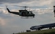 A UH-1N Iroquois takes off from the flightline for a seven-ship formation flight during a Tactical Response Force exercise at Minot Air Force Base, North Dakota, Aug. 21, 2025. The seven helicopters carried Tactical Response Force members for an exercise, employing airpower and air superiority in defense of our nation’s nuclear deterrence arsenal. (U.S. Air Force photo by Senior Airman Alyssa Bankston)