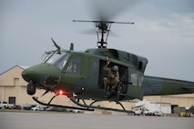 A UH-1N Iroquois helicopter takes off on the flightline for a formation flight at Minot Air Force Base, North Dakota, Aug. 21, 2025. The Air Force began using the UH-1N Iroquois in 1970 for search and rescue missions and later expanded its role to include missile security. (U.S. Air Force photo by Airman 1st Class Wesley Davies)