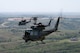 Three UH-1N Iroquois fly in formation during a seven-ship formation flight at Minot Air Force Base, North Dakota, Aug. 21, 2025. The seven helicopters carried Tactical Response Force members for an exercise, employing airpower and air superiority in defense of our nation’s nuclear deterrence arsenal. (U.S. Air Force photo by Airman 1st Class Wesley Davies)