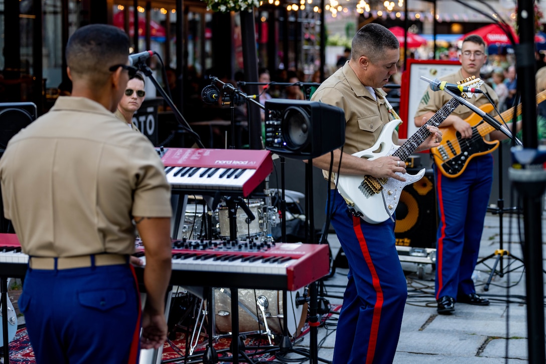 U.S. Marines with the Quantico Marine Rock Band perform at Faneuil Hall Marketplace during Marine Week Boston, Aug. 22, 2025. Marines stationed across the globe commemorate the 250th anniversary of the Marine Corps, honoring a distinguished legacy of service, sacrifice, and unwavering fidelity to both the nation and fellow Marines. (U.S. Marine Corps photo by Sgt. Chancellor Reynolds)