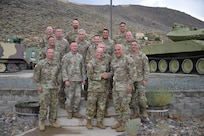 Brig. Gen. Randy Lau, right, Nevada land component commander, and Brig. Gen. James Packwood, right, Idaho assistant adjutant general, Army, shake hands in front of Nevada and Idaho Army Guard leadership during a planning meeting Aug. 27, 2025.