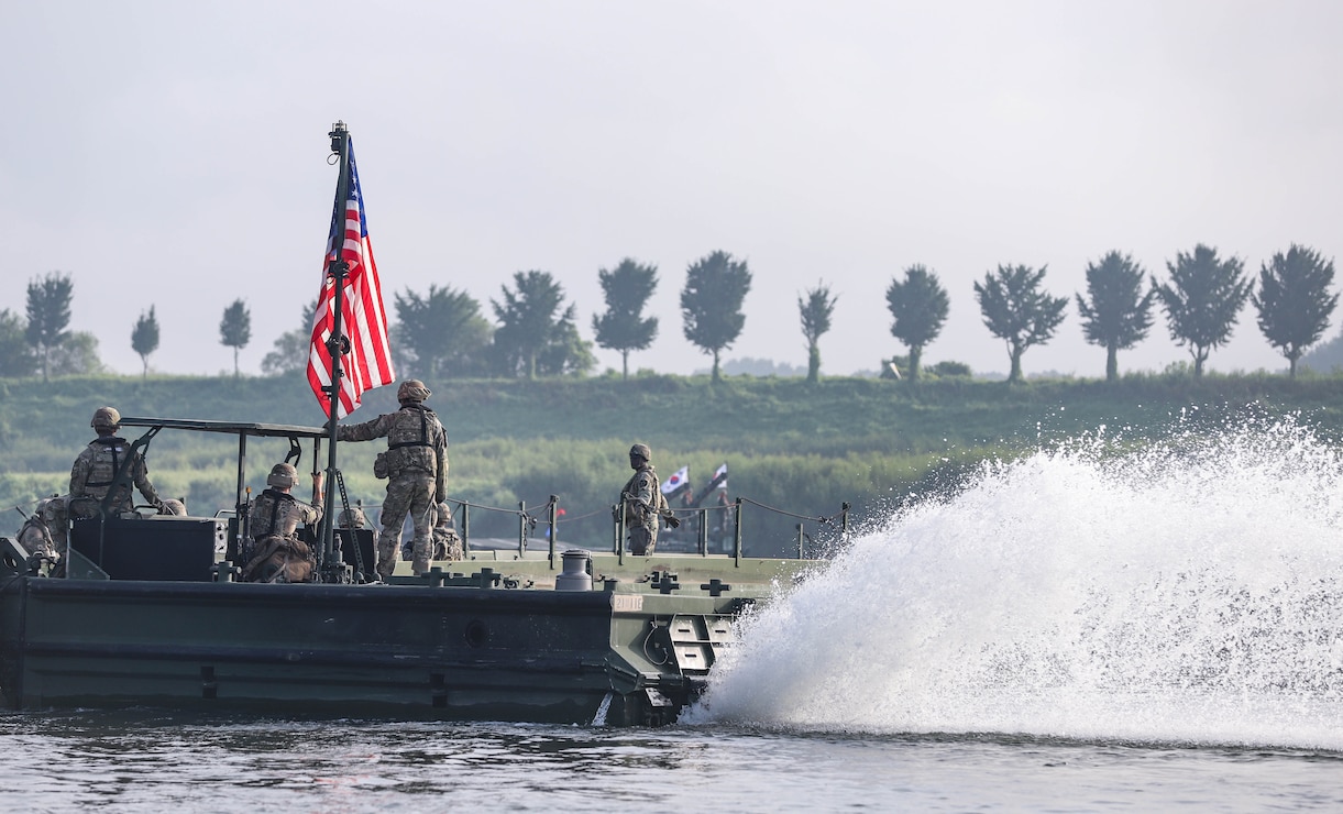U.S. Army Soldiers assigned to the 11th Engineer Battalion, 2d Infantry Division Sustainment Brigade, 2d Infantry Division/ROK-U.S. Combined Division pull security on a bridge erecting boat during combined wet gap crossing training as part of Ulchi Freedom Shield near Yeoju, South Korea, Aug 27, 2025.