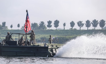 U.S. Army Soldiers assigned to the 11th Engineer Battalion, 2d Infantry Division Sustainment Brigade, 2d Infantry Division/ROK-U.S. Combined Division pull security on a bridge erecting boat during combined wet gap crossing training as part of Ulchi Freedom Shield near Yeoju, South Korea, Aug 27, 2025.