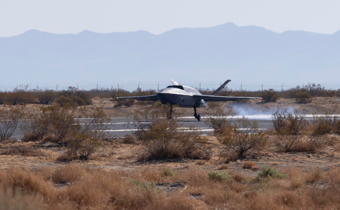 An aircraft lands on a runway.