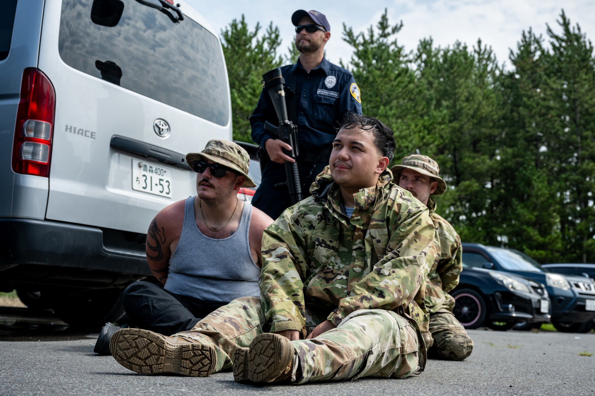 U.S. Air Force Airmen assigned to the 35th Security Forces Squadron are detained during a simulated base defense scenario  at Shariki Communications Site, Japan, Aug. 19, 2025.