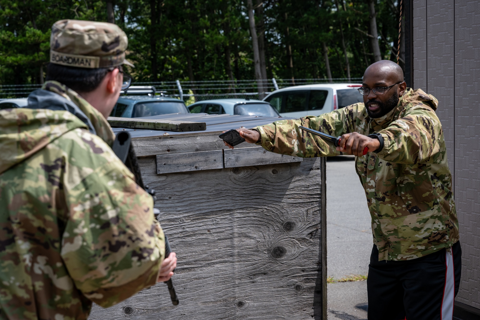 U.S. Army Pfc. Chandler Boardman, 10th Missile Defense Battery RADAR operator, orders a U.S. Air Force Airman assigned to the 35th Security Forces Squadron to drop his weapons and raise his hands during a simulated base defense scenario at Shariki Communications Site, Japan, Aug. 19, 2025.