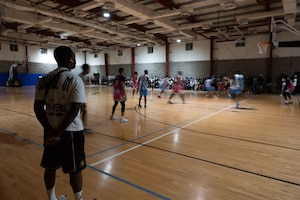 The Expeditionary Logistics Readiness Squadron vehicle maintenance basketball team, the Bombshells, play during a base basketball game within the U.S. Central Command area of responsibility, Aug. 24, 2025. The 379th ELRS vehicle maintenance shop supports the Wing’s mission by keeping its extensive fleet, including leased and emergency vehicles, fully functional around the clock. (U.S. Air Force photo by Senior Airman Dieondiere Jefferies)
