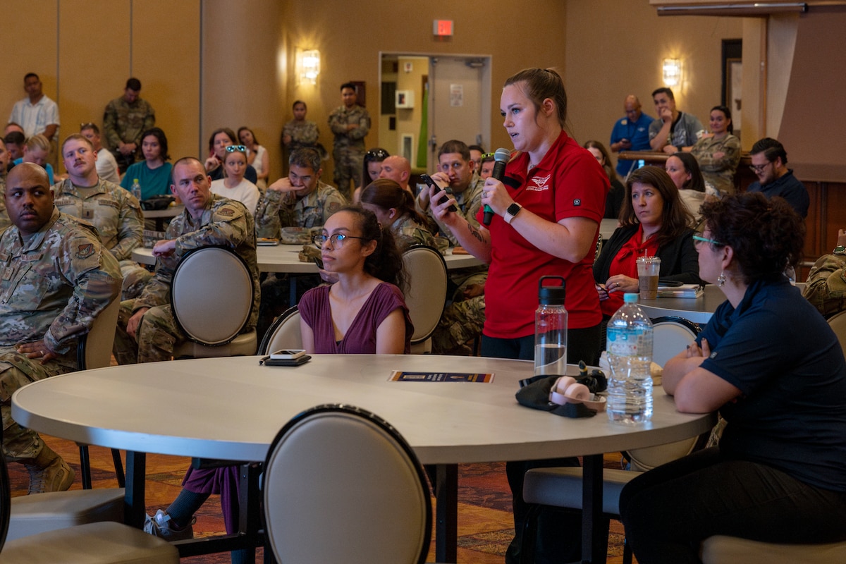 An attendee asks panel members a question during a 35th Fighter Wing (FW) open forum town hall at Misawa Air Base, Japan, Aug. 27, 2025.