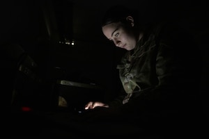 U.S. Air Force Senior Airman Lesleigh Partlow, 379th Expeditionary Operations Support Squadron aircrew flight equipment journeyman, reviews the technical order for night vision goggles within the U.S. Central Command area of responsibility, Aug. 6, 2025. NVGs are inspected every 30 to 120 days to ensure equipment is within compliance. (U.S. Air Force photo by Senior Airman Amanda Jett)