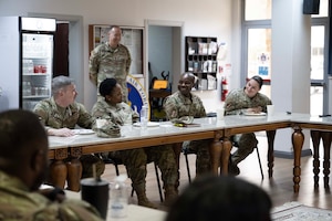 U.S. Air Force Col. Albert Esposito, 39th Air Base Wing commander and Chief Master Sgt. Kim Elliott, 39th ABW interim command chief, speak with members of the 39th ABW Chapel team during an immersion tour at Incirlik Air Base, Türkiye, Aug. 27, 2025. The Chapel team supports Airmen through spiritual development and provides leadership advice. (U.S. Air Force photo by Senior Airman Greydon Furstenau)