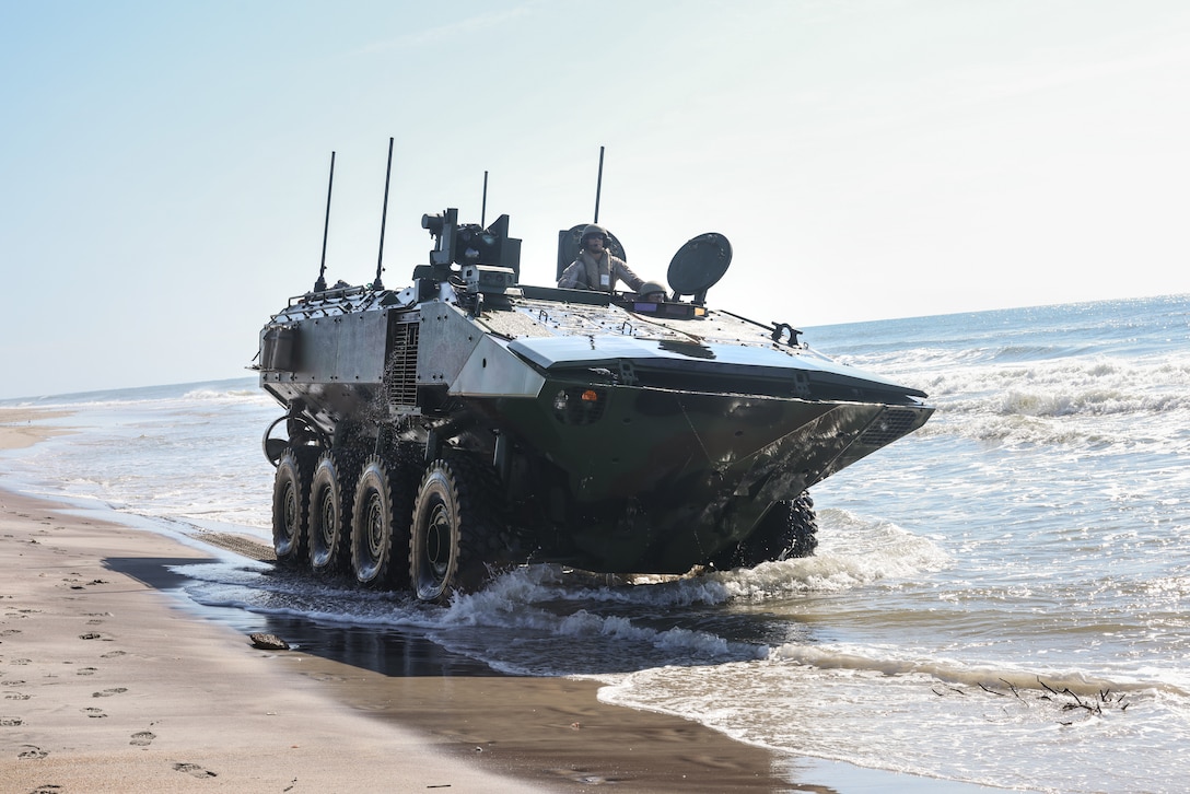 U.S. Marines with 2nd Assault Amphibian Battalion, 2nd Marine Division, operated an Assault Combat Vehicle during Operator New Equipment Training at Marine Corps Base Camp Lejeune, North Carolina, on August 25, 2025. OPNET is a specialized program focused on training 2nd Assault Amphibian Battalion, 2nd Marine Division, on the Amphibious Combat Vehicle to ensure its safe and effective operation in any environment. (U.S. Marine Corps photo by Lance Cpl. Dominic Trujillo)