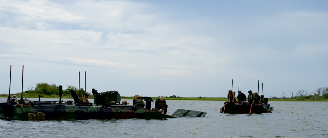 An amphibious combat vehicle operates in the water at Camp Lejeune, NC