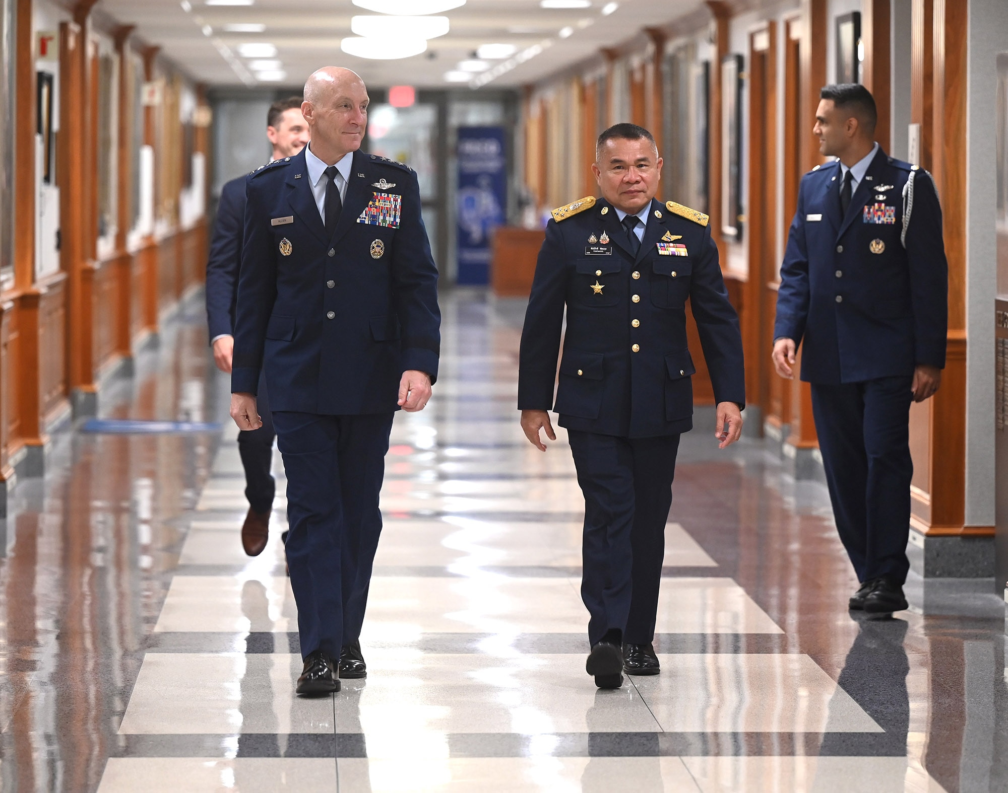 Air Force Chief of Staff Gen. David Allvin walks with Royal Thai Air Force Air Chief Marshal Punpakdee Pattanakul in the Pentagon, Arlington, Va., Aug. 20, 2025.The pair were on hand to take part in a meeting and exchanged gifts. (U.S. Air Force photo by Andy Morataya)