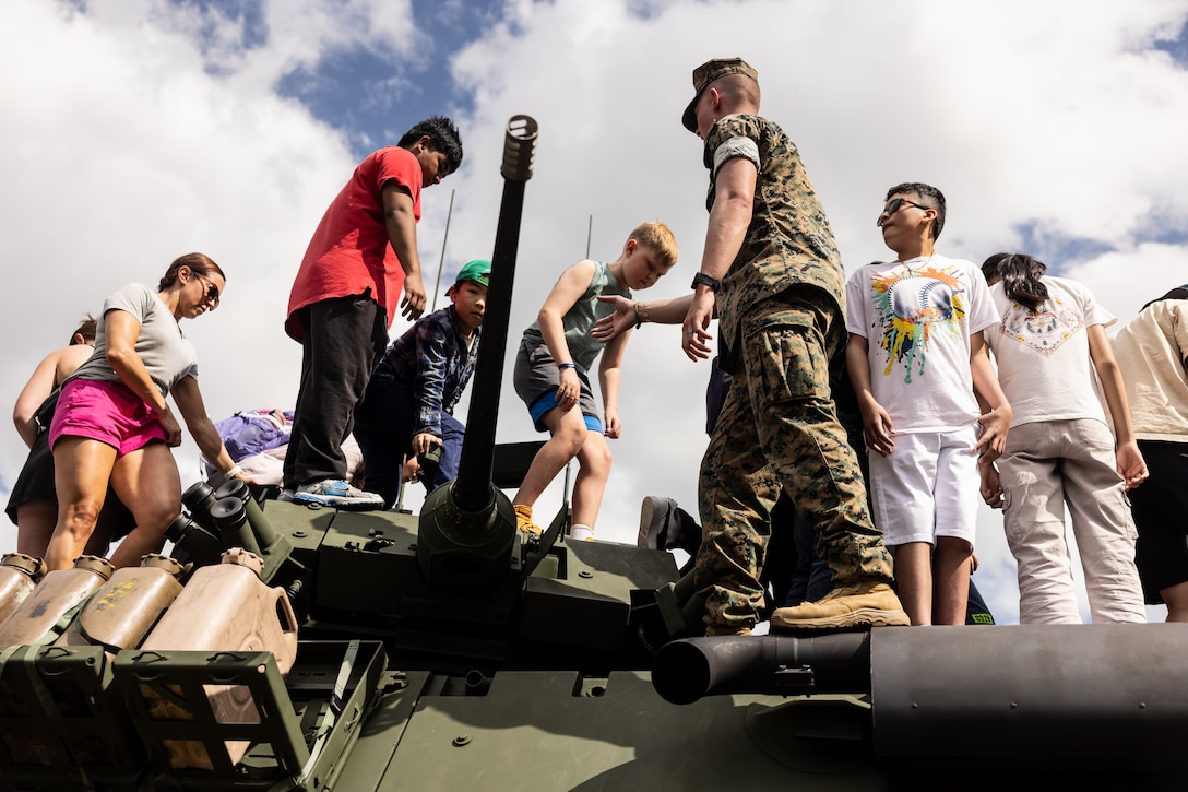 U.S. Marines assigned to Special-Purpose Marine Air-Ground Task Force-250 and Bostonians interact at various Marine Corps static display sites during Marine Week Boston, Aug. 24, 2025. Marines stationed across the globe commemorate the 250th anniversary of the Marine Corps, honoring a distinguished legacy of service, sacrifice and unwavering fidelity to both the nation and fellow Marines. (U.S. Marine Corps photo by Lance Cpl. Abigail Hutcheson)