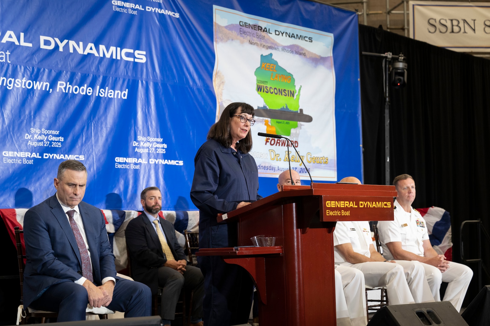 Dr. Kelly Geurts, ship sponsor of the future Columbia-class ballistic missile submarine USS Wisconsin (SSBN 827), delivers remarks during the ship’s keel laying ceremony.